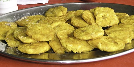 Twice-fried green plaintains (Tostones) with garlic-cilantro aïoli dip