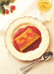 Two orange terrine with mint and a raspberry sauce