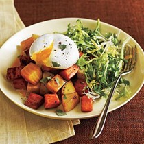 Two potato and beet hash with poached eggs and greens