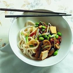 Udon noodles with mushrooms, tofu and edamame