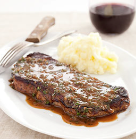 Ultimate pan-seared steaks with herb sauce