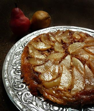 Upside down bread pudding with caramelized pears and brandied custard sauce