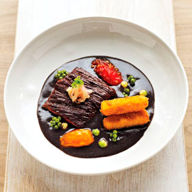 Vaca frita with black bean broth and creamy rice croquettes