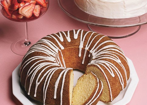 Vanilla bean bundt cake with vanilla glaze and strawberries