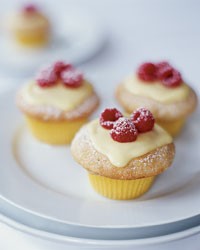 Vanilla cupcakes with lemon cream and raspberries