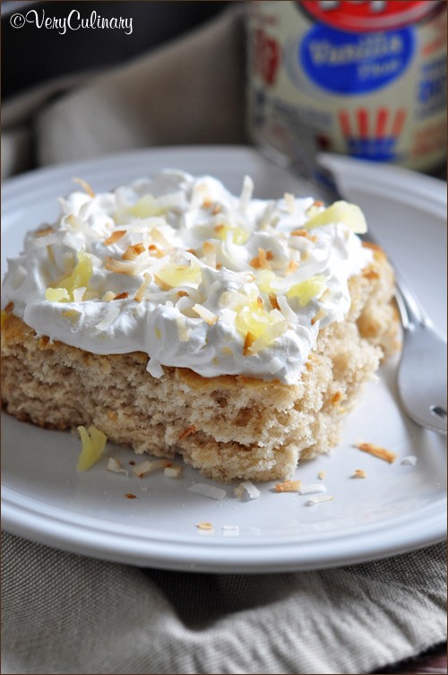 Vanilla float cake with pineapple whipped cream and toasted coconut