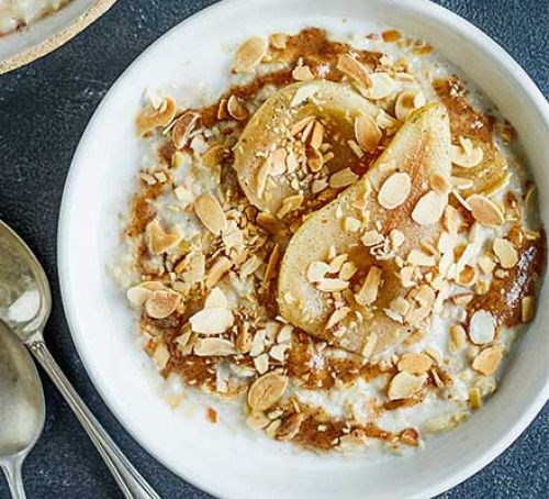 Vanilla poached pears with almond butter porridge topping