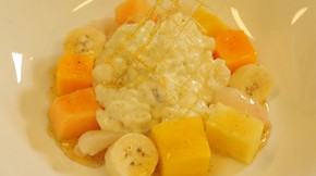 Vanilla rice pudding with tropical fruits and lychee and lime syrup