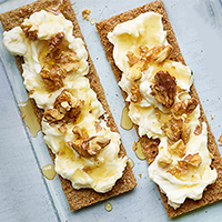 Västerbottensost cheese open sandwich with walnuts and honey