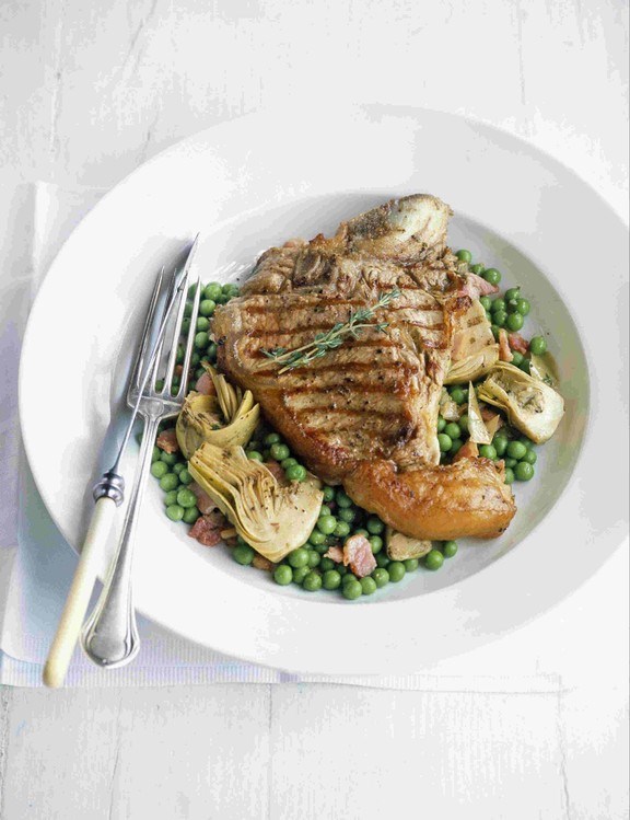 Veal chops with peas, artichokes and bacon