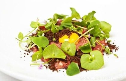 Veal tartare with dark malt crumble, wild herbs and quail eggs