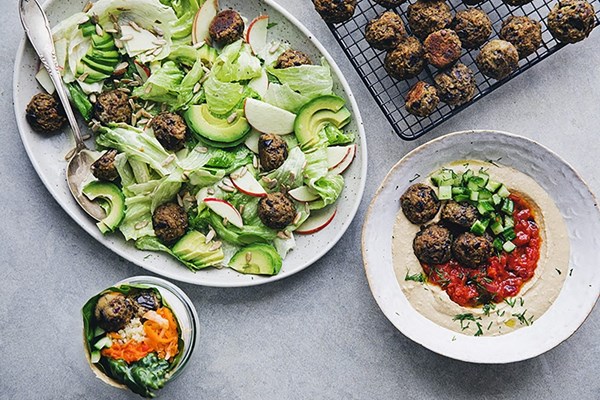 Vegan aubergine polpette — three ways [hummus with spicy tomato sauce; polpette and cucumber salad; vegan wrap with polpette, ajvar and krauts; vegan Caesar salad with polpette]