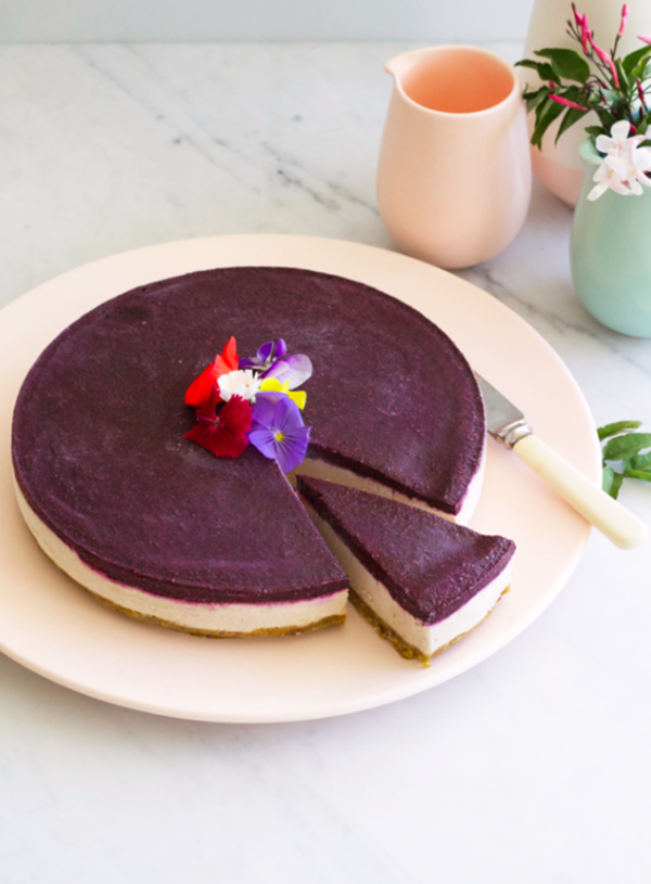 Vegan 'cheesecake' with almond and pistachio base, ginger vanilla filling and blueberry chia jelly
