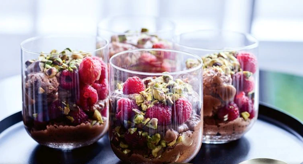 Vegan chocolate mousse with berries and pistachio