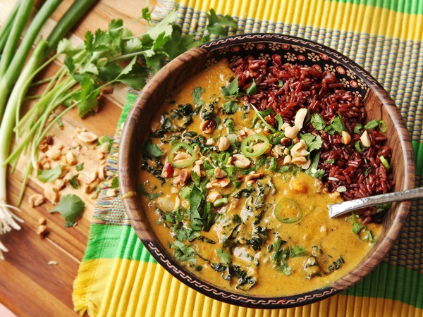 Vegan peanut, sweet potato, and kale soup with coconut