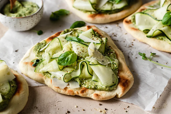 Vegan zucchini flatbreads with roasted garlic pesto