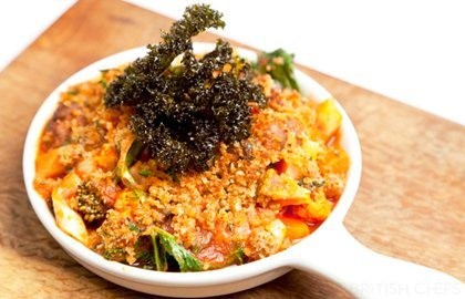 Vegetable and chestnut stew with sage crust and crispy kale