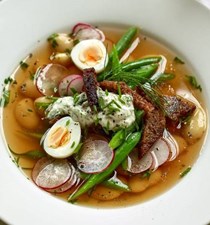 Vegetable broth with radishes, rye bread and herby yogurt