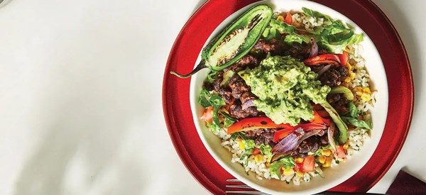 Vegetable burrito bowls [cilantro-lime rice; chile-corn salsa; guacamole]