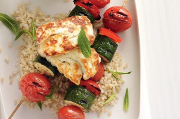 Vegetable kebabs with grilled haloumi, garlic yogurt and lemon rice