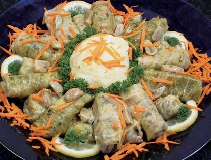 Vegetable-stuffed cabbage rolls (Mihshi malfoof bi zeyt)