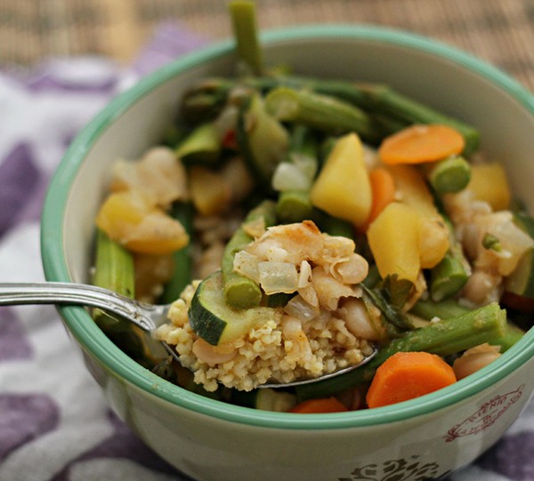 Vegetables in spiced broth over millet
