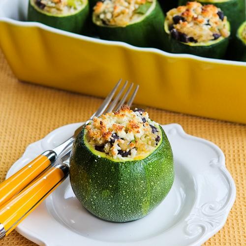 Vegetarian stuffed zucchini with brown rice, black beans, chiles, cheddar, and cotija cheese