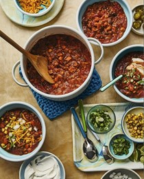 Vegetarian three-bean chili with all the toppings 