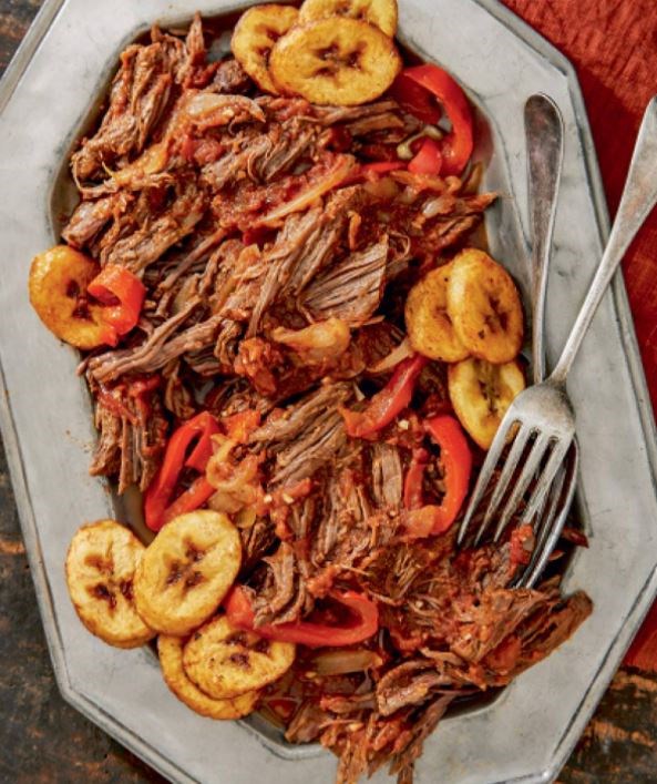 Venezuelan shredded skirt steak with sliced peppers and onions (Carne mechada) [Héctor Arguinzones]