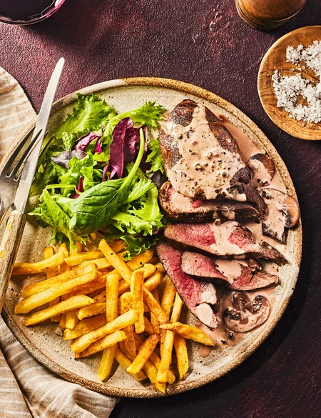 Venison steaks with mushroom peppercorn sauce