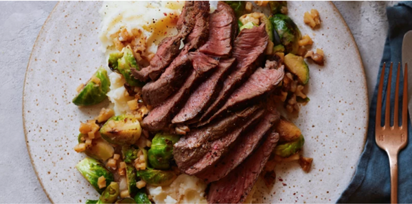 Venison steaks with stir-fried sprouts