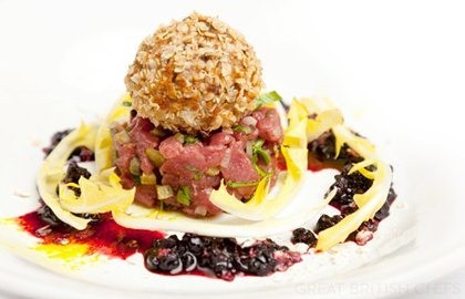 Venison tartare with haggis Scotch egg and elderberry dressing