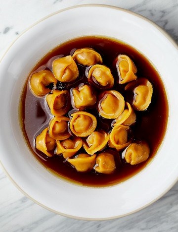 Venison tortellini in brodo with lardo di colonnata and sage