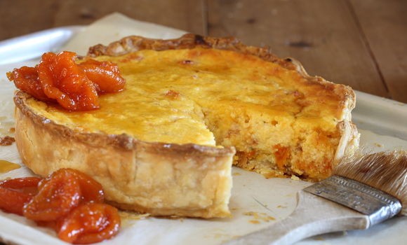 Verjuice curd tart with dried apricots in verjuice syrup