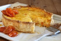 Verjuice curd tart with dried apricots in verjuice syrup