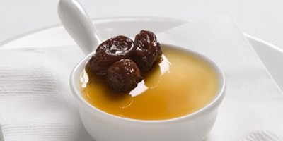 Verjuice custards with bergamot-braised raisin clusters