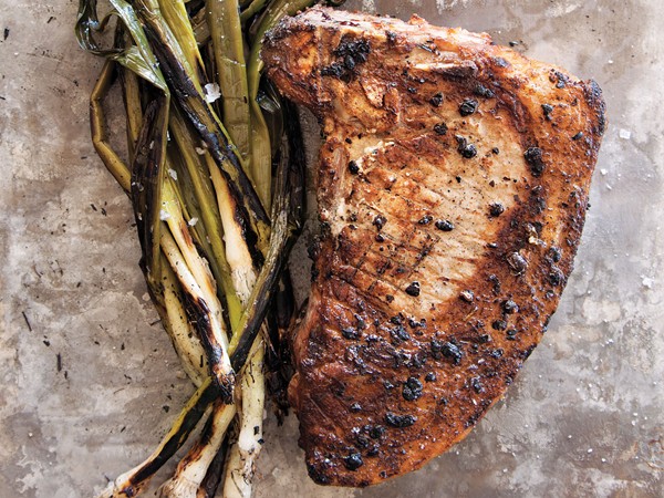 Verjus-brined pork chops with marinated leeks