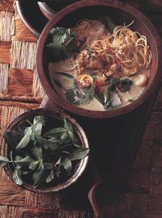Vietnamese chicken noodle hotpot with fresh leaves