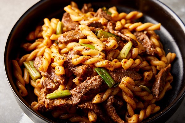Vietnamese stir-fried pasta with beef (Nui xao bo)