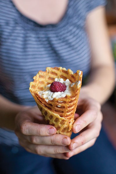 Waffle cones filled with sweet cheese and berries (Pilditas vafeles)