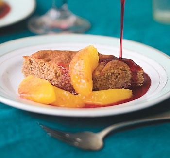 Walnut and almond cake with orange-pomegranate compote