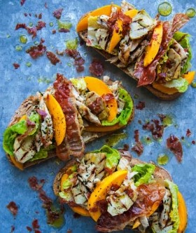 Walnut bread with chicken, mango and artichoke, honey and sherry vinegar dressing and Parma ham crisps