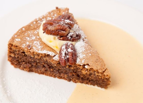 Walnut cake, pecans and cream
