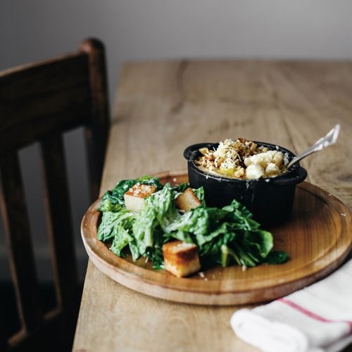 Walnut-crusted Brie mac and cheese with apples and pancetta