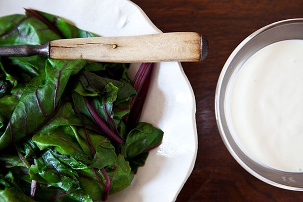 Warm beet greens with sour cream dressing