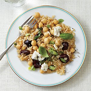 Warm brown rice and chickpea salad with cherries and goat cheese