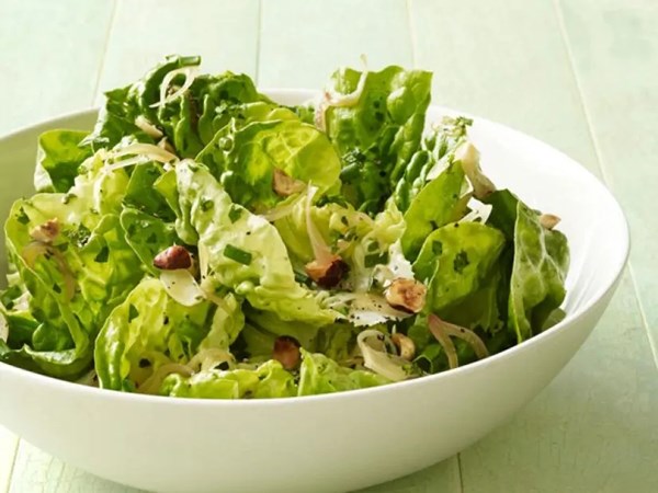 Warm butter lettuce salad with hazelnuts