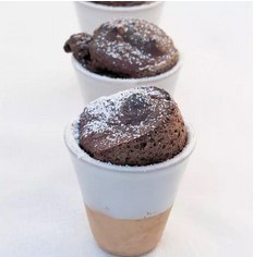 Warm chocolate rum soufflés with chocolate sauce