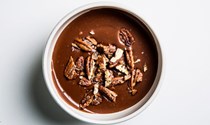 Warm cocoa pudding with candied pecans
