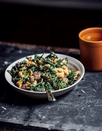 Warm kale, white bean + mushroom salad with chilli tahini